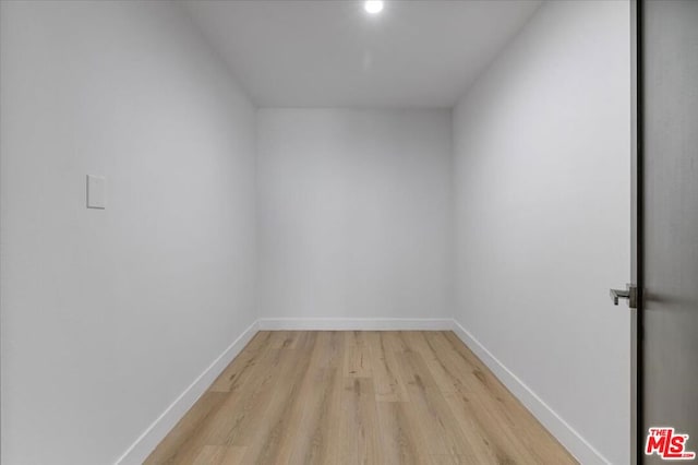 spare room with light hardwood / wood-style flooring