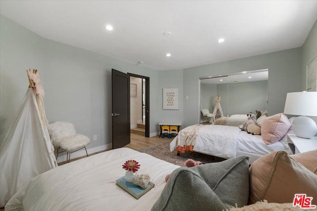 bedroom with a closet and light wood-type flooring