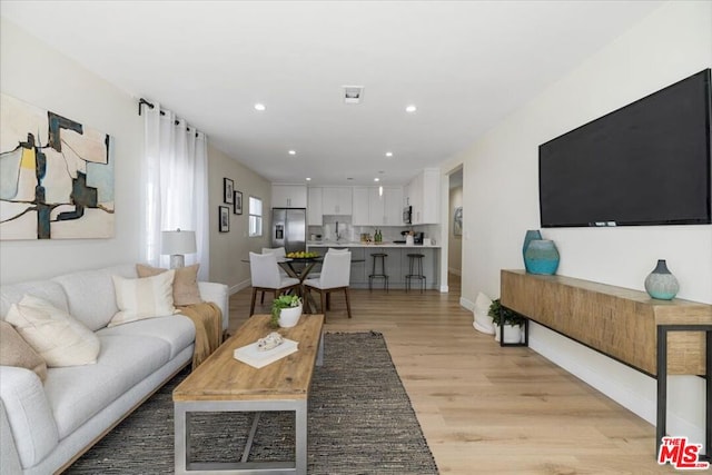 living room featuring light wood-type flooring