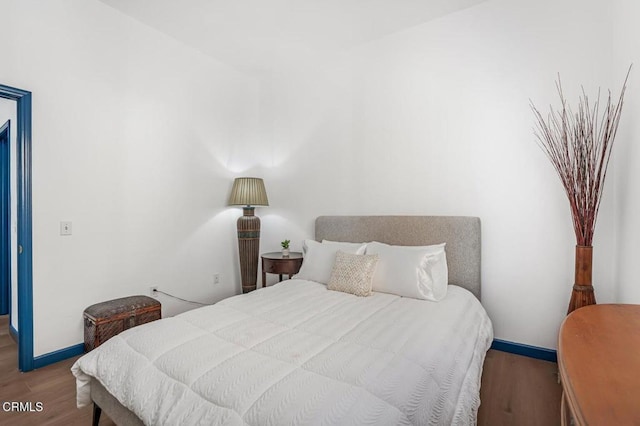 bedroom featuring hardwood / wood-style flooring