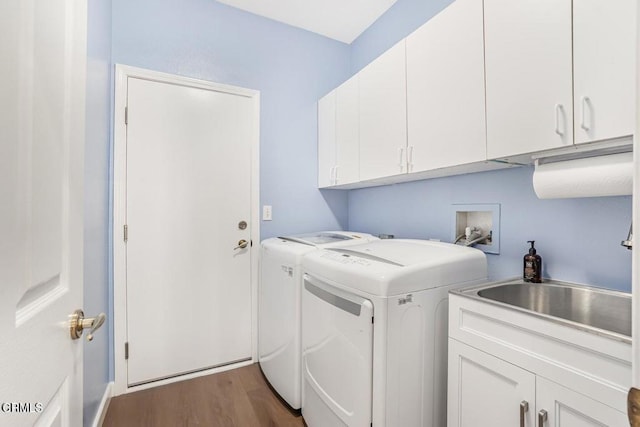 clothes washing area featuring cabinets, dark wood-type flooring, sink, and independent washer and dryer