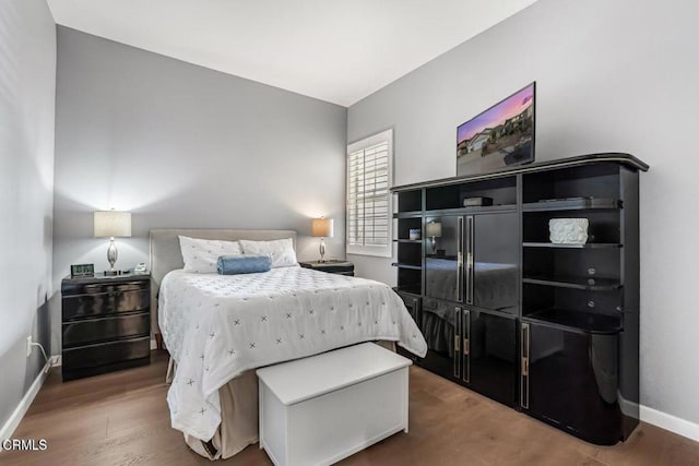 bedroom with wood-type flooring