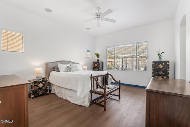 bedroom featuring ceiling fan and dark hardwood / wood-style floors