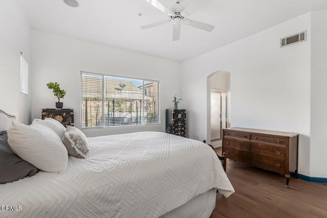 bedroom with dark hardwood / wood-style floors and ceiling fan