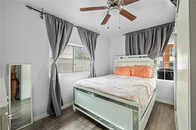 bedroom featuring dark wood-type flooring and ceiling fan