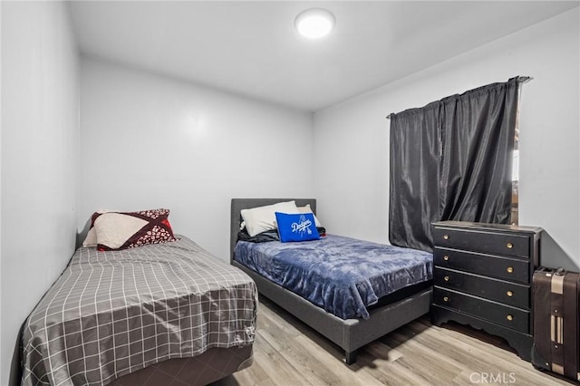 bedroom featuring light wood-type flooring