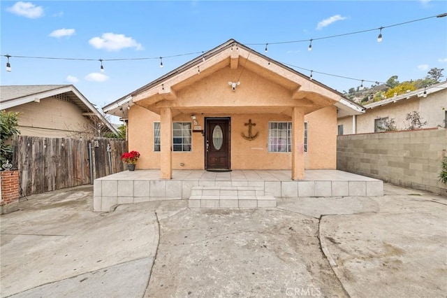 bungalow with a patio area