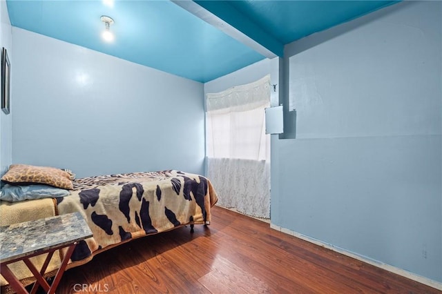 bedroom with hardwood / wood-style floors