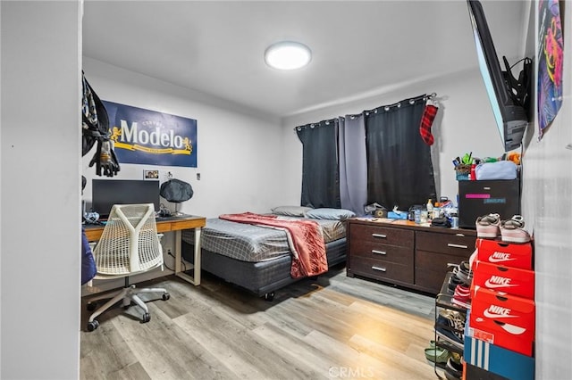 bedroom with light hardwood / wood-style floors