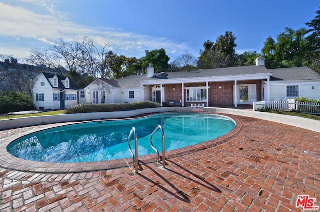 view of pool featuring a patio area