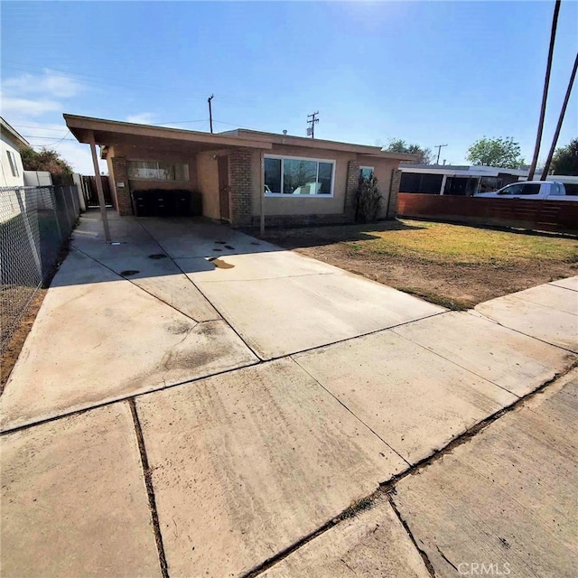 ranch-style home featuring a carport