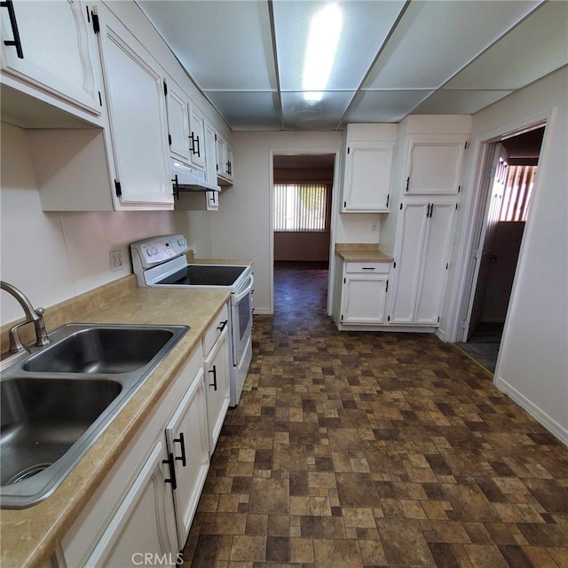 kitchen with white cabinetry, sink, and white range with electric stovetop