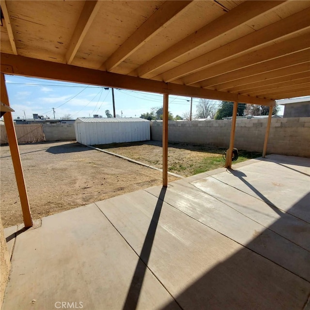 view of patio / terrace with a storage shed