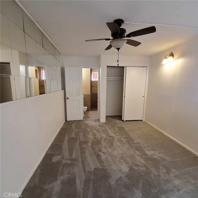 interior space with carpet floors, ceiling fan, and a closet