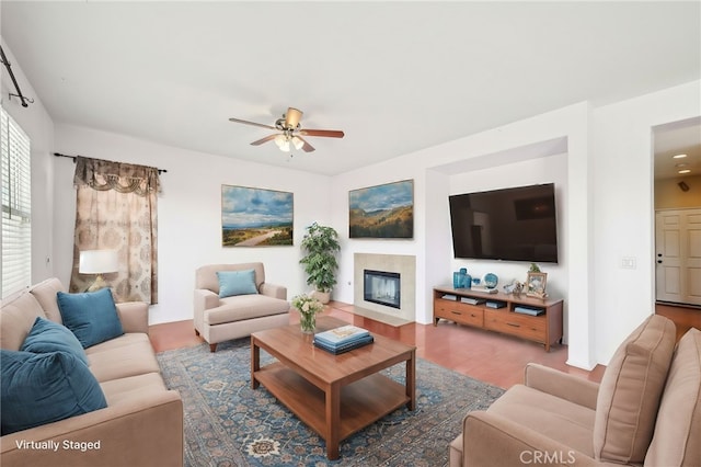 living room with hardwood / wood-style flooring and ceiling fan