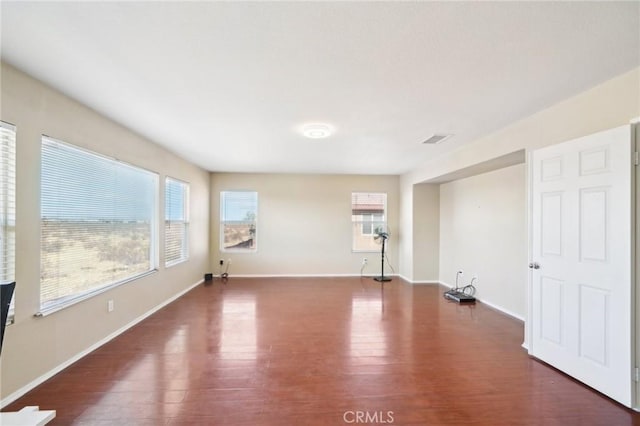 unfurnished room featuring dark hardwood / wood-style floors