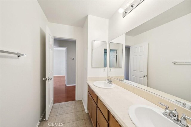 bathroom featuring tile patterned flooring and vanity