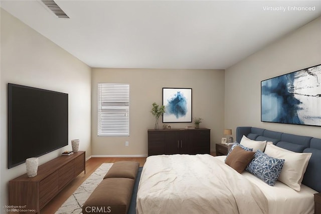 bedroom featuring light wood-type flooring