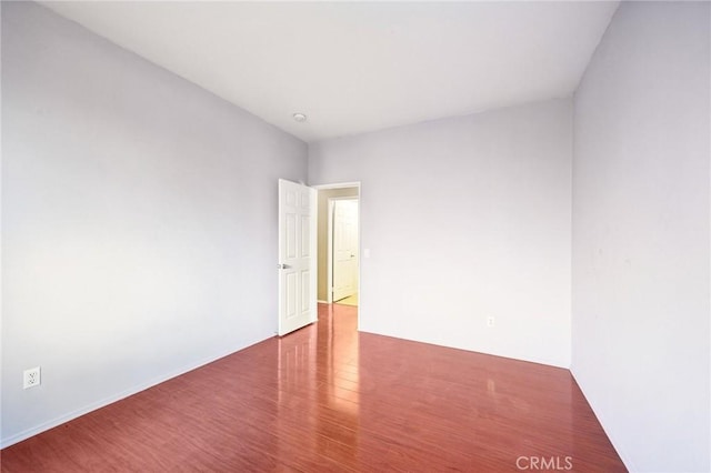 empty room featuring hardwood / wood-style floors