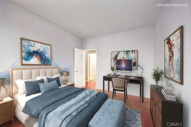 bedroom with dark hardwood / wood-style flooring