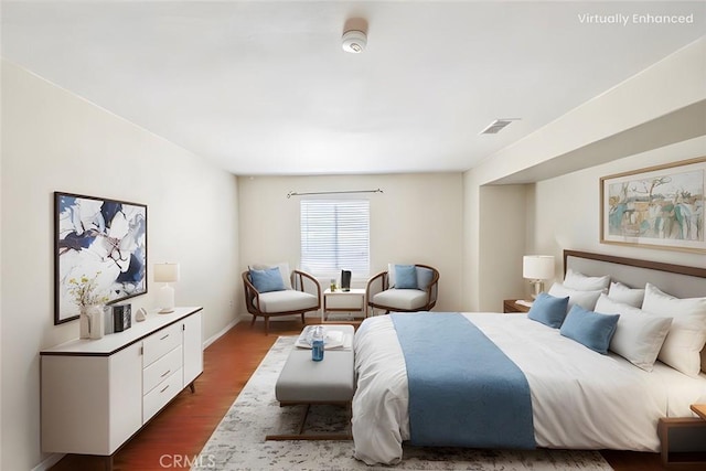 bedroom featuring dark hardwood / wood-style flooring