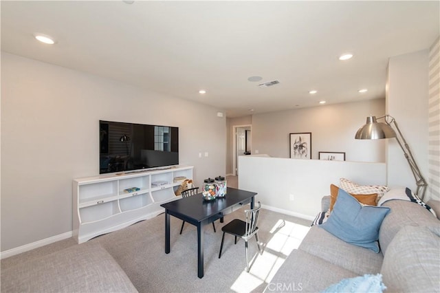 living room featuring light carpet