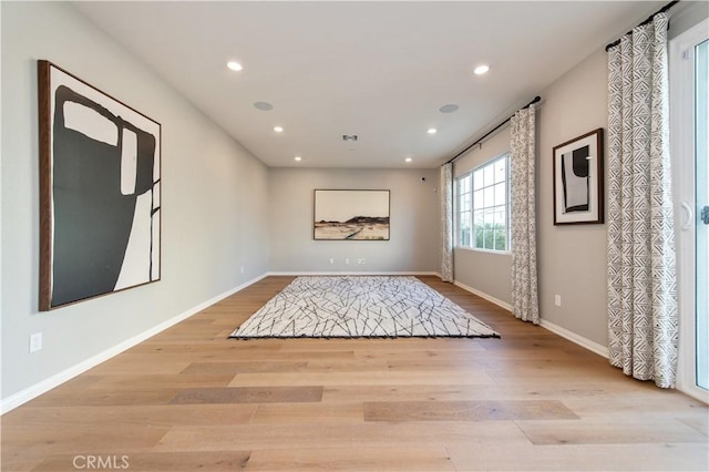 unfurnished room featuring light hardwood / wood-style flooring