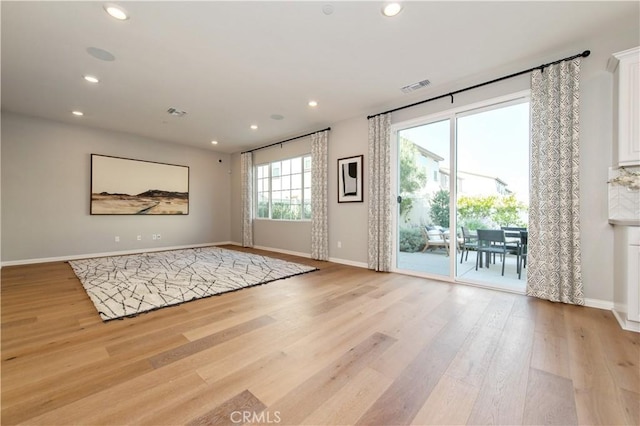 doorway to outside with light wood-type flooring