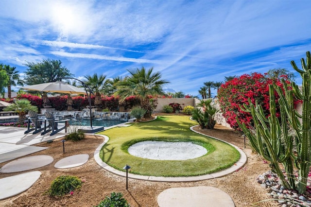 view of home's community with a pool and a patio