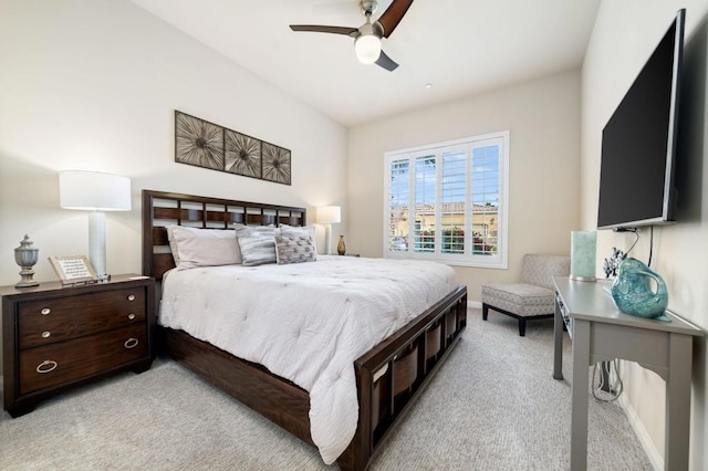 bedroom featuring light colored carpet and ceiling fan