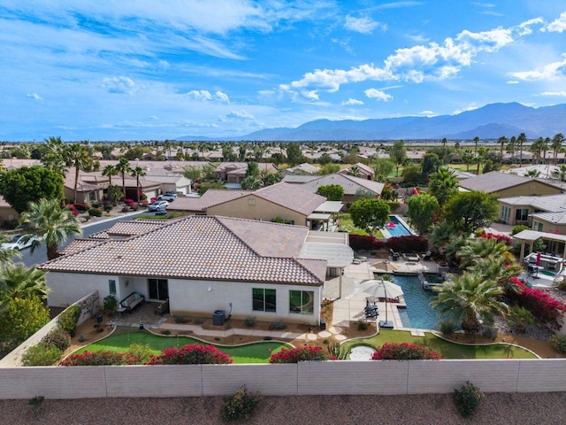 birds eye view of property with a mountain view