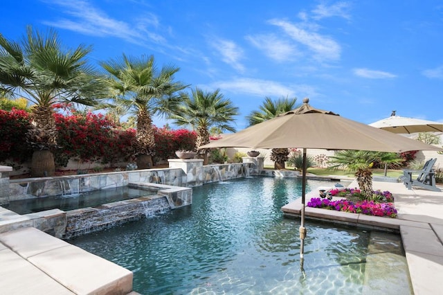 view of swimming pool with an in ground hot tub, pool water feature, and a patio area