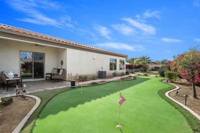 exterior space with a patio, cooling unit, and ceiling fan