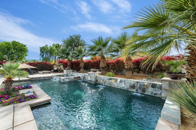 view of pool with pool water feature