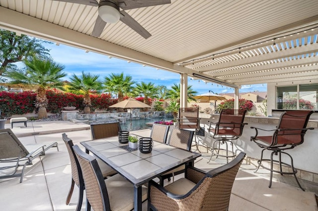 view of patio / terrace with a fenced in pool, a bar, ceiling fan, and a pergola