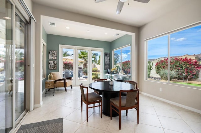 dining room with french doors, ceiling fan, and light tile patterned floors