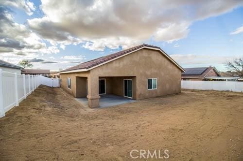 rear view of house with a patio