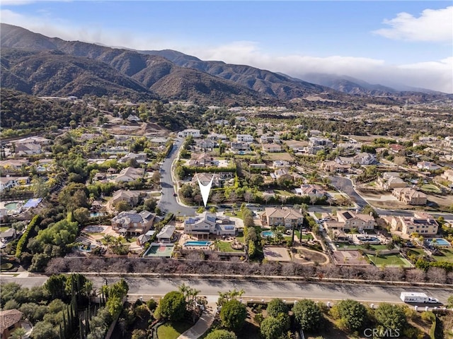 birds eye view of property with a mountain view