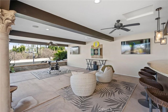 living room with beamed ceiling and ceiling fan