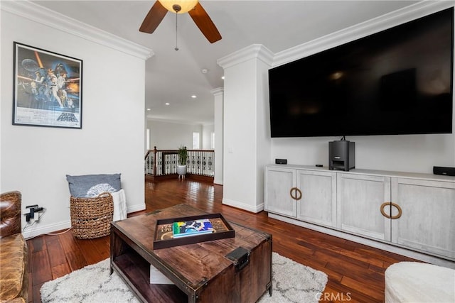 living room featuring ornamental molding, ceiling fan, and dark hardwood / wood-style flooring