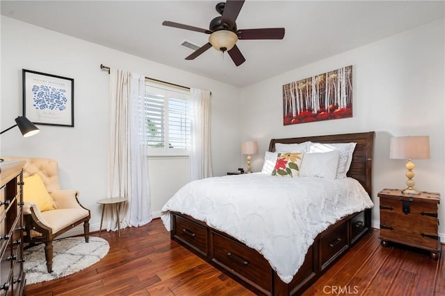 bedroom with dark hardwood / wood-style floors and ceiling fan