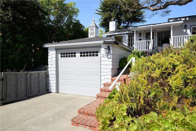 2130 Glenneyre St, Laguna Beach, CA 92651 - view of front of home with a chimney, concrete block siding, and concrete driveway