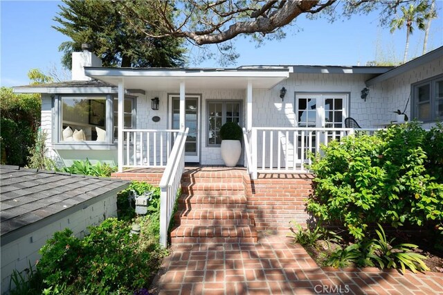 2130 Glenneyre St, Laguna Beach, CA 92651 - doorway to property featuring a chimney and a porch