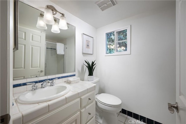 2130 Glenneyre St, Laguna Beach, CA 92651 - full bath featuring toilet, tile patterned floors, vanity, and a shower
