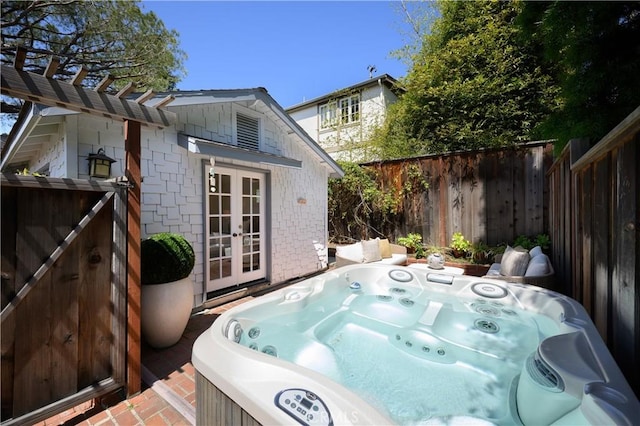 2130 Glenneyre St, Laguna Beach, CA 92651 - deck with french doors, a hot tub, and a fenced backyard