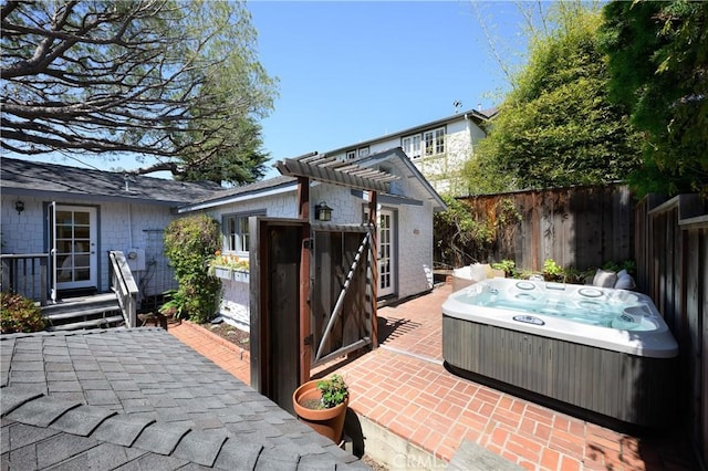 2130 Glenneyre St, Laguna Beach, CA 92651 - view of patio featuring a hot tub and an outbuilding