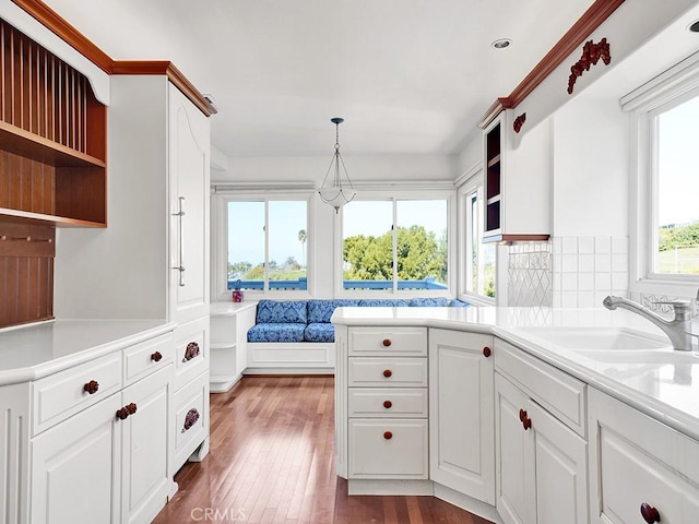 931 Gardenia Way, Corona Del Mar, CA 92625 - kitchen with a sink, open shelves, white cabinetry, tasteful backsplash, and dark wood-style floors