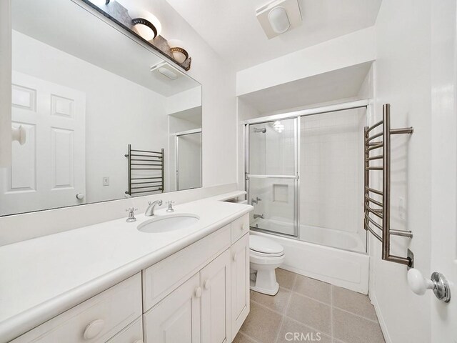 931 Gardenia Way, Corona Del Mar, CA 92625 - full bathroom featuring bath / shower combo with glass door, toilet, tile patterned flooring, and vanity