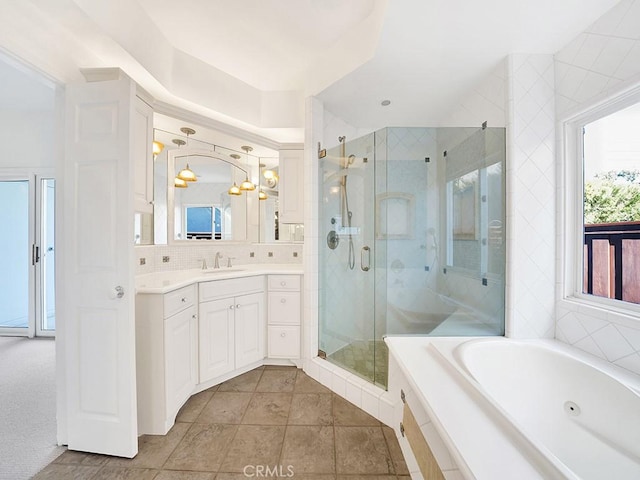 931 Gardenia Way, Corona Del Mar, CA 92625 - bathroom with a stall shower, a wealth of natural light, a jetted tub, and vanity