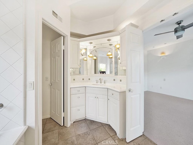 931 Gardenia Way, Corona Del Mar, CA 92625 - bathroom featuring visible vents, ceiling fan, decorative backsplash, and vanity